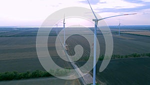 Aerial view of the air turbine in the middle of the cultivated field