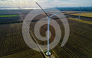 Aerial view of air turbine in a stopped position in a field off the coast