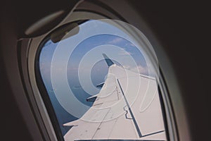 Aerial View from Aircraft Window to the Male Island among the Blue Indian Ocean