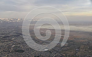 Aerial view from airplane of Antelope Island at sunset, view from Magna, sweeping cloudscape at sunrise with the Great Salt Lake