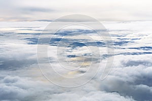 Aerial view from an airplane on a cloudy day.