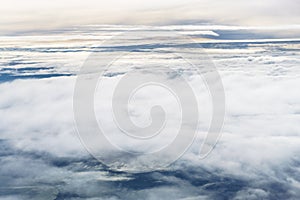 Aerial view from an airplane on a cloudy day.