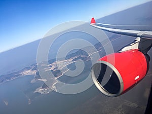 An aerial view from the airplane flying high above the ground