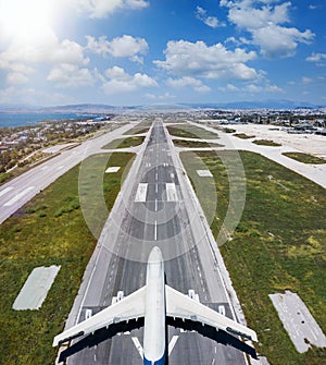 Aerial view of an airplane standing on a airport runway