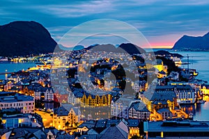 Aerial view of Alesund, Norway at sunset. Colorful night sky