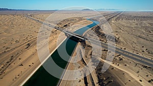 Aerial view of all-American canal crossing under the I8 freeway surrounded by sand dunes