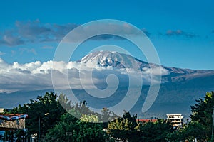 Aerial view of Almight Kilimanjaro mountain landscape under blue sky