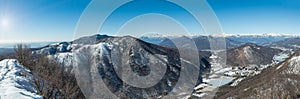 Snow capped Alps mountain range, Italy. In the foreground the Valganna photo