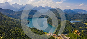 Aerial view on Alpsee lake and Hohenschwangau Castle, Bavaria, Germany. Concept of traveling and hiking in German Alps