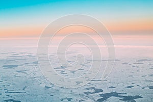 Aerial View From Altitude Flight Of Aircraft On Snow-covered Ground