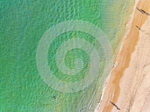 Aerial view Amazing sandy beach and small waves Beautiful tropical sea in the morning summer season image by Aerial view drone