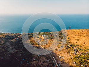 Aerial view of Amed village with sea and evening sunlight
