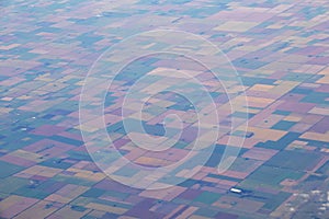 Aerial view of american countryside, farmland from the plane with green agriculture fields