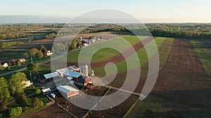 Aerial view of american countryside landscape. Farm, red barn, cows. Rural scenery, farmland. Sunny morning, spring summer season