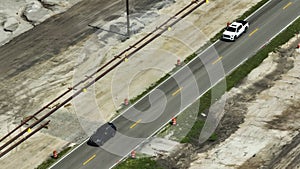 Aerial view of american highway under construction with moving traffic. Development of road infrastructure