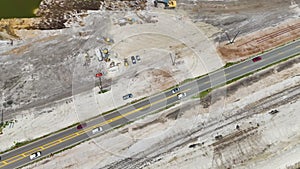 Aerial view of american highway under construction with moving traffic. Development of road infrastructure