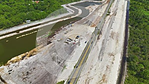 Aerial view of american highway under construction with moving traffic. Development of road infrastructure