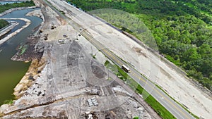 Aerial view of american highway under construction with moving traffic. Development of road infrastructure