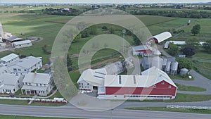 Aerial view of amish church meeting with horse and buggies on a sunny summer day