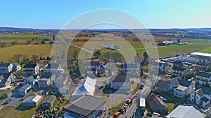 Aerial View of an Amish Mud Sale with Buggies, Farm Equipment and Other Crafts