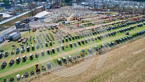 Aerial View of an Amish Mud Sale with Lots of Buggies and Farm Equipment