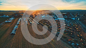 Aerial View of an Amish Mud Sale with Lots of Buggies and Farm Equipment