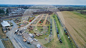 Aerial View of an Amish Mud Sale with Lots of Buggies and Farm Equipment