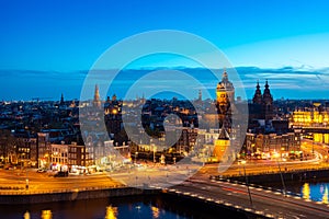 Aerial view of Amsterdam skyline in historical area at night in Amsterdam, Netherlands