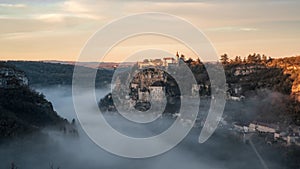 Aerial view of ancient french village, Rocamadour sunrise timelapse with fogs in the Canyon of the Alzou