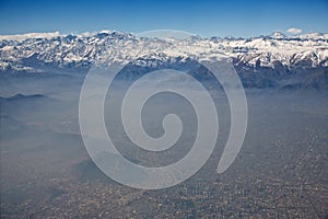 Aerial view of Andes and Santiago with smog