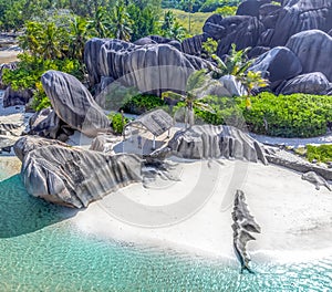Aerial view of Anse Source d\'Argent with its huge granite rocks and palms