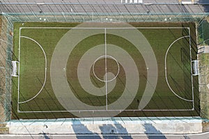 Aerial view ao a soccer field in a public park inside a town