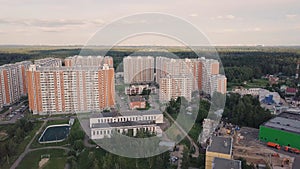 Aerial view apartment buildings complex and residential houses neighborhood. Clip. Top view of the modern luxery