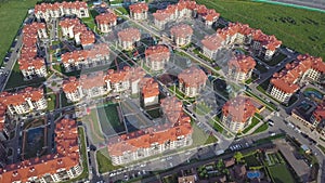 Aerial view apartment buildings complex and residential houses neighborhood. Clip. Top view of the modern luxery