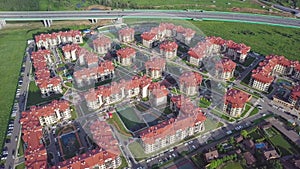 Aerial view apartment buildings complex and residential houses neighborhood. Clip. Top view of the modern luxery