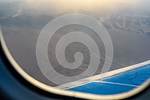 Aerial view on arabian desert and Red sea mountains from the airplane window