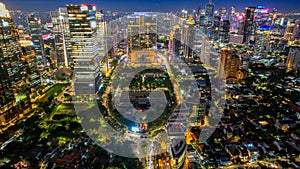 Aerial view of Architecture details Modern Building Glass facade Business background at night. Jakarta, Indonesia, November 9,