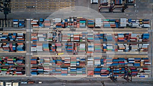 Aerial view of area with stacked containers at the port, Top view stack of freight containers in rows at the shipyard, Global