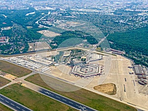 aerial view of areal of former Berlin Tegel Airport with big tents as Refugee accommodation
