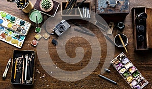 Aerial view of artistic euqipments painting tools on wooden table