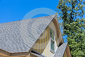 Aerial view the asphalt shingles roofing construction waterproofing for new house in covered corner roof shingles