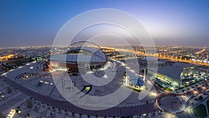 Aerial view of Aspire Zone stadium from top night to day timelapse in Doha