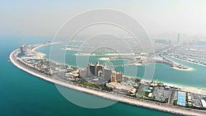 Aerial view of Atlantis hotel and roads leading to Palm Jumeirah man-made islands located on the coast of Dubai,