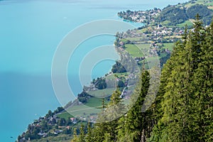 Aerial view of Attersee lake in Austria, with a clear sight of the coast line road