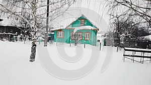 Aerial view authentic wooden rustic blue house facade winter countryside snowfall nature landscape