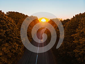 aerial view of autumn highway in forest