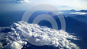 Aerial view of Bali island from the airplane. The earth panorama with Bali island view , mountain, blue sky and white cloud