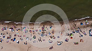 Aerial view of Baltic Sea beach with swimming people in Wladyslawowo, Poland