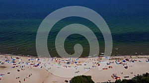 Aerial view of Baltic Sea beach with swimming people in Wladyslawowo, Poland