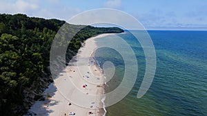 Aerial view of Baltic Sea beach with swimming people in Wladyslawowo, Poland